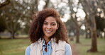 Woman, face and happy in park with relax for travel, adventure and fresh air with laughing for fun. Person, portrait and smile with confidence outdoor in nature with wellness, peaceful and calm