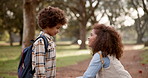 Black mother, child and forest with backpack for love, care or support on path to school in nature. African mom helping little boy or kid getting ready with bag at outdoor park for learning journey