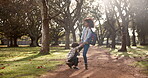 Mother, child and angry for school outdoor with tantrum, struggle and fighting in the park with backpack. Family, woman and son with behavior problem for preschool in forest with conflict and stress