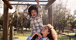 Mother, child and playing with monkey bars at park for fun bonding, outdoor holiday or weekend in nature. Happy little boy or kid with parent in joy or happiness for hanging in playground at forest