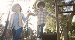 Mother, playground and holding hands with child for fun bonding, playing or outdoor holiday at park. Mom with little boy, child or kid balancing on wood for childhood, youth or activity at forest