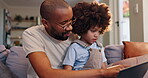Father, son and teaching with laptop, online and man with boy for education, elearning and living room. Home, dad and kid with computer, knowledge and growth with development for child in house