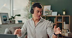 Man, dance and headphones with sound in office for radio, entertainment and listening to music. Technology, happy and creative designer with energy at desk for podcast, audio and streaming service