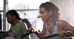 Woman, bike and exercise in gym for fitness with cardio training, endurance and wellness challenge. Athlete, person and aerobic machine or crossfit with hard work, determination and intense workout