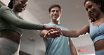 Happy people, fitness and hands together with team at gym for workout, exercise or training. Group piling or touching with high five for motivation, agreement or collaboration at indoor health club