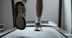 Person, runner and legs with treadmill for exercise, training or cardio workout in fitness at gym. Closeup of athlete, feet or shoes walking on machine for weight loss or wellness at health club