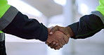 Architect, people and handshake with meeting for agreement, deal or partnership at site. Closeup of engineers, colleagues or team shaking hands for architecture, construction or building at workplace