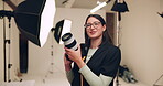 Photographer, camera and laugh in studio for 
photography, media and magazine cover as creative. Cameraman, happy and female person backstage for shooting, production and brand as director with lens