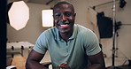 Photographer, man and face or happy in studio for creative career, production and confidence backstage. Professional artist, photography and portrait of african person with laughing behind the scenes