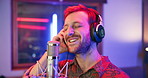 Man, musician and singing in music studio for song recording with microphone for voice control. Production, talent and passionate artist with headphone as singer for album, playlist and neon color