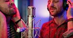 Microphone, music and people with singing in studio for production, broadcast and audio media. Musician, headphones and artist in neon with recording for sound, entertainment or collaboration on song