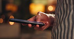 Man, hands and smartphone in closeup for chat with connection, contact and networking at night. Person, mobile and touchscreen with bokeh, text or scrolling on social media app for web communication