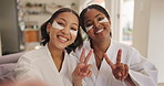 Women, friends and selfie with eye mask, peace sign and happy with face, relax and beauty on sofa in home. Girl, people and kiss with symbol, emoji or icon with cosmetics, skincare and social media