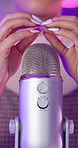 ASMR, microphone and girl hands in studio for scratch, social media or influencer by neon lights. Female content creator, recording or audio with equipment for sound, satisfaction or online audience