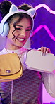 Woman, bag and fashion on live stream in home for headphones, choice or shopping advice on web. Girl, influencer or person with handbag, promo and happy for deal, sale or microphone on social media