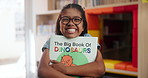 Girl, child and portrait with book in kindergarten, happiness for storytelling or literacy education. Female student, youth classroom and kid with smile for knowledge or learning, glasses with hug