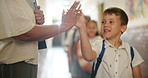 Greeting, children and high five teacher in school for enter classroom, learning and education for growth or development. Girl, boys and students fist bump for welcome, motivation and morning routine