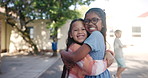 Girl, children and face with hug on playground for friendship, youth and childhood connection with unity. Female kids, portrait and bonding together in school with embrace, affection and happiness.