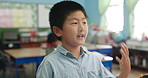 Boy, talking and answer with student in classroom, kindergarden and lesson or quiz solution with Asian learner. Academic, growth and education development, knowledge discussion and children listening