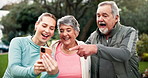 Fitness coach, senior people and phone with talk, point or happy at park for training in morning. Elderly man, women and smartphone with app for schedule, progress and laugh on lawn in New Orleans