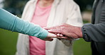 Teamwork, stack hands and people outdoor for celebration, success or motivation. Group, friends and huddle together closeup for solidarity of community with trust, connection or support for goal park