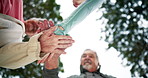 Teamwork, stack hands and low angle of people outdoor for celebration, success or motivation. Group, friends and huddle together for solidarity of community, connection or support for goal park below