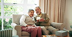 Senior couple, people and smile with photo album in home at living room for memories, nostalgia and retirement. Relationship, love and bonding in lounge as pensioner with support, care and trust