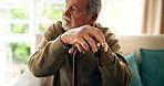 Sad, thinking and senior man with cane on sofa for depression, memory or nostalgia in living room. Thoughtful, elderly and person with walking stick for regret, grief or remember in retirement home