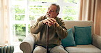 Sad, thinking and senior man with walking stick on sofa for depression, memory or nostalgia in living room. Thoughtful, elderly and person with cane for regret, grief or remember in retirement home