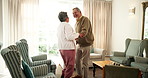 Senior couple, people and happy with dancing in home at living room for fun, joy and retirement. Relationship, love and bonding in lounge as pensioner with support, care and trust as soulmate