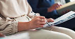 Business employee, hands and writing with document in meeting, seminar or staff training at office. Closeup of person or trainee checking information and taking notes on paperwork for presentation