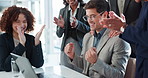 Businessman, applause and team with laptop for promotion, congratulations or winning at office. Happy man or employee with group clapping on technology for achievement, deal or success at workplace