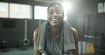 Face, smile and towel with woman in gym for start of exercise, training or workout routine. Break, portrait and sweating with happy African person in health club for improvement or performance