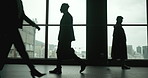 Office, window and silhouette of man with walking, thinking and action in law firm. Male lawyer, people and commute in building for scheduled meeting, professional and confidence in workplace