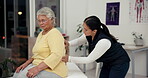 Back pain, examination and senior woman with nurse, checkup and elderly care in clinic for healthcare. Retirement, help and patient with service of injury or physiotherapist with smile in hospital