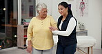 Support, walking and senior woman with nurse, checkup and elderly care in clinic for healthcare. Retirement, service and helping of  patient with balance and physiotherapist with smile in hospital