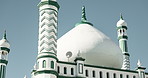 Islamic, building and mosque or architecture outdoor for religious worship, prayer and tower with landmark. Holy temple, structure and roof for Muslim religion or culture with design or dome in Asia
