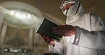 Man, quran and praying in mosque for faith or religion, worship and muslim for islam or praise Allah. Male person, spiritual and reflection of holy book for knowledge, learning and study for peace