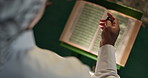 Praying, muslim or man with Quran or beads in mosque for spiritual reading, religious worship or top view. Islamic person, hands or holy book with Tasbih for Gaza hope, faith and trust in solidarity