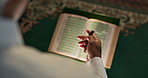 Praying, muslim or person with Quran or beads in mosque for spiritual reading, religious worship or top view. Islamic, hands or holy book with Tasbih for Gaza hope, faith and trust in solidarity