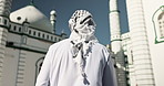 Muslim, religion and man by mosque with keffiyeh scarf for Palestine resistance, peace and religion solidarity. Back, Islamic person and holy building for prayers, strength and perseverance in unity