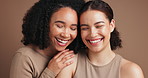 Friends, laugh and cosmetics in studio for skincare, makeup and support on brown background. Women, embrace and confident in dermatology or foundation glow, facial treatment and together for beauty