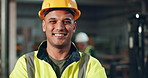 Proud, worker and helmet of man in construction, safety and industry of engineering, face and building. Industrial, happy and portrait of person, smile and joy of employee in factory and working