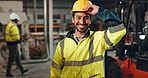 Helmet, worker and safety of man in construction, laughing and industry of engineering, face and building. Industrial, happy and portrait of person, smile and joy of employee in factory and warehouse