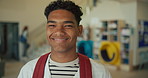 Smile, high school and portrait of teenager boy with backpack for education, growth and development on campus. Happy, face and student in lobby of learning academy with confidence, pride or knowledge