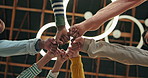 Team, hands and fist bump from below for goal, success and collaboration on campus. Diverse group, hand in circle and students in college for project, development and huddle for unity or solidarity