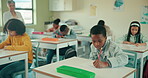 Exam, teacher and students in classroom for group, test and knowledge in elementary school. Education, childhood development and desk for assessment, campus and learning for young people in academy 