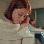 High school, stress and girl in classroom with headache, anxiety or ...