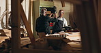 Carpenter, high five and construction support with renovation, warehouse and manufacturing success. Woodworking, happy men and builder collaboration with teamwork and contractor employee in workshop
