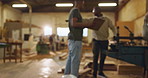 Carpentry, wood and teamwork in factory for production, manufacturing of furniture in workshop. Project management, lumber and men in warehouse for explaining, construction and showing with equipment